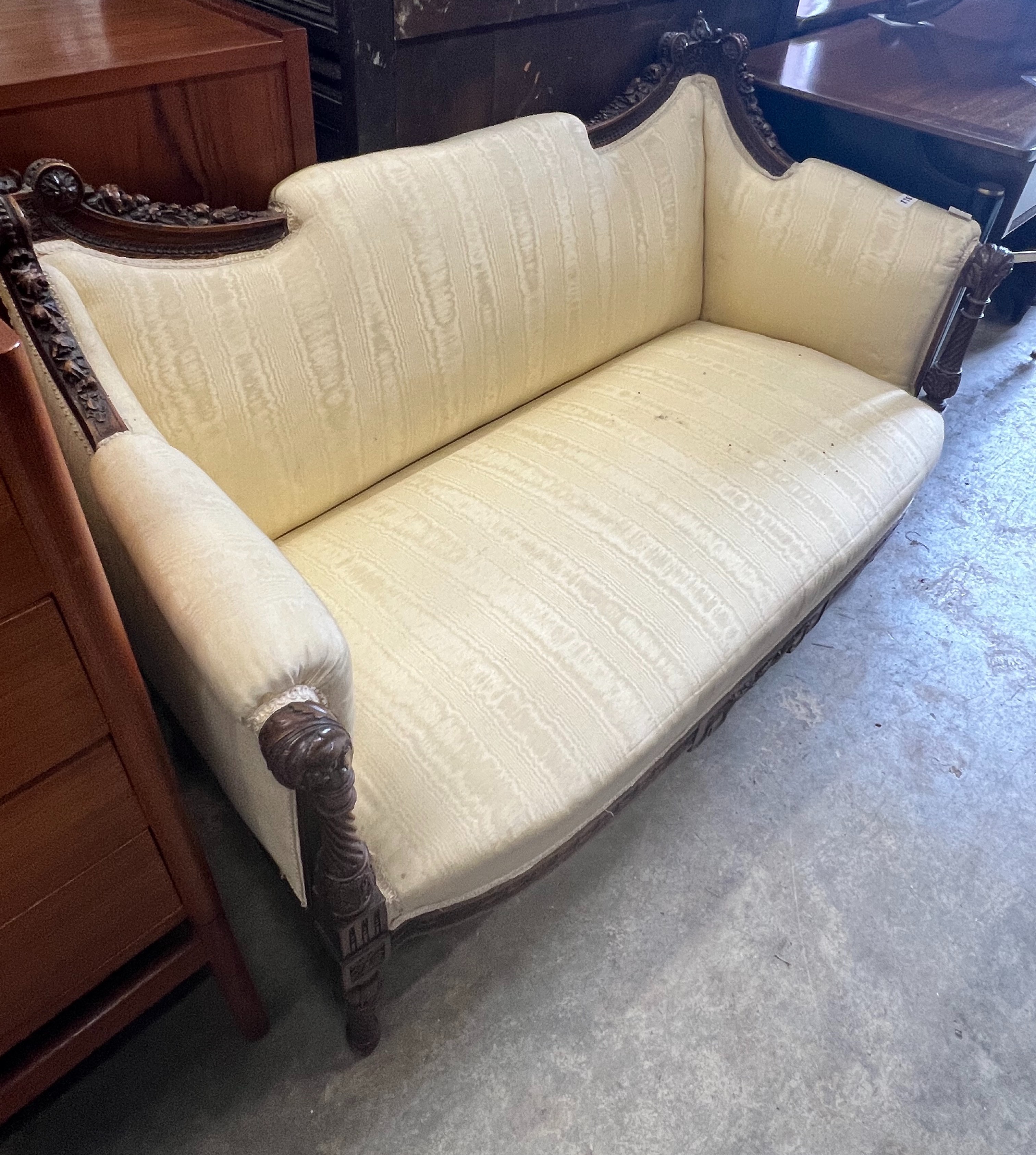 An early 20th century French carved walnut canapé, width 122cm depth 58cm height 81cm